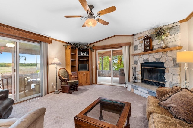 N5101 Lueck Ln, Princeton, WI 54968 - living area with carpet, crown molding, a ceiling fan, vaulted ceiling, and a stone fireplace