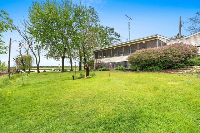 N5101 Lueck Ln, Princeton, WI 54968 - view of green lawn with a sunroom