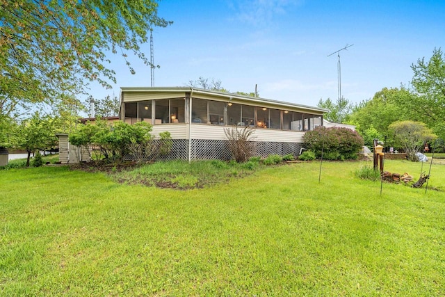 N5101 Lueck Ln, Princeton, WI 54968 - rear view of property featuring a sunroom and a lawn