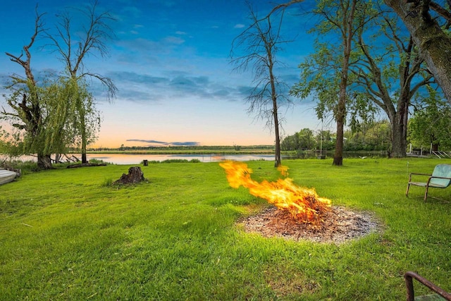 N5101 Lueck Ln, Princeton, WI 54968 - view of green lawn featuring a fire pit and a water view