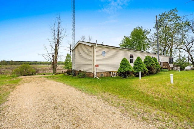 N5101 Lueck Ln, Princeton, WI 54968 - view of side of property featuring crawl space and driveway