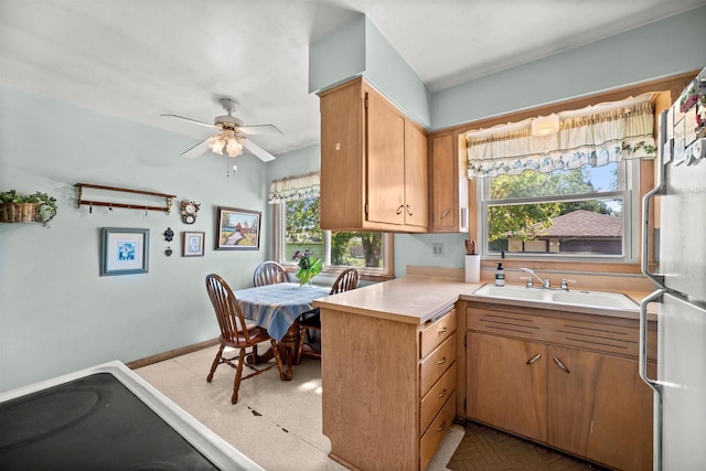 2804 S 64th St, Milwaukee, WI 53219 - kitchen with a sink, plenty of natural light, a peninsula, and light countertops
