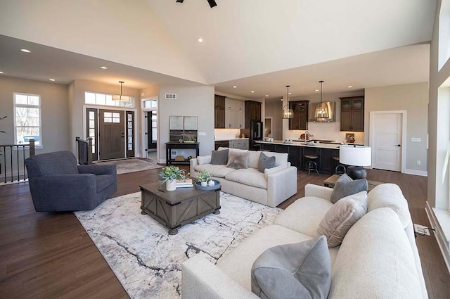 W214N6684 Fairview Dr, Menomonee Falls, WI 53051 - living room featuring dark wood-type flooring, recessed lighting, and high vaulted ceiling