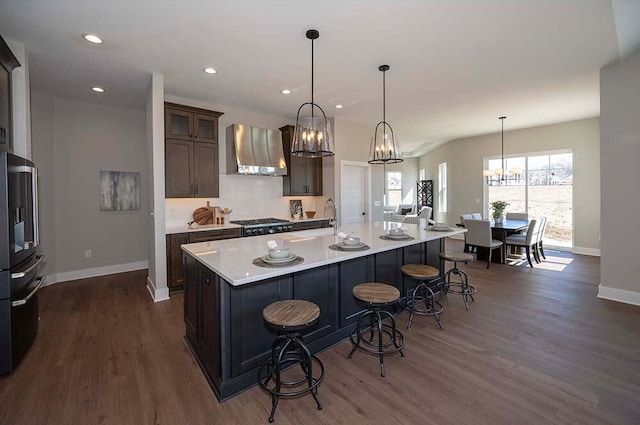 W214N6684 Fairview Dr, Menomonee Falls, WI 53051 - kitchen featuring wall chimney exhaust hood, stainless steel refrigerator with ice dispenser, dark wood-style floors, baseboards, and a chandelier