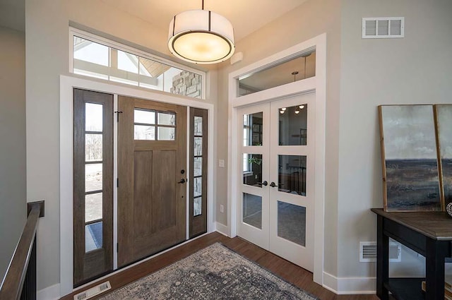 W214N6684 Fairview Dr, Menomonee Falls, WI 53051 - entrance foyer with french doors, wood finished floors, and baseboards
