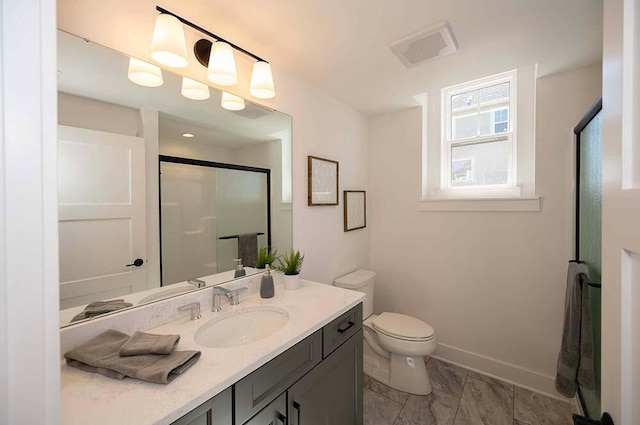 W214N6684 Fairview Dr, Menomonee Falls, WI 53051 - bathroom featuring vanity, a stall shower, toilet, baseboards, and marble finish flooring