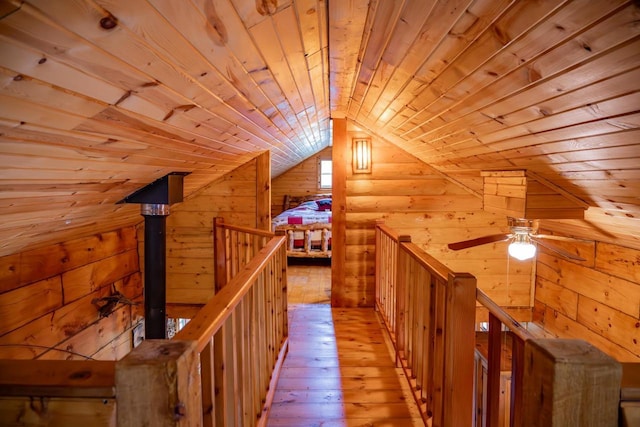 N8378 Timber Trl, New Lisbon, WI 53950 - hall with wood ceiling, wooden walls, an upstairs landing, lofted ceiling, and light wood finished floors
