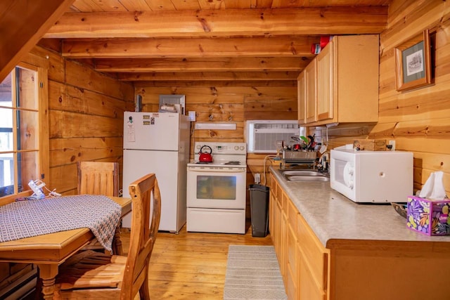 N8378 Timber Trl, New Lisbon, WI 53950 - kitchen featuring white appliances, a sink, wood walls, light wood-type flooring, and a wall mounted air conditioner