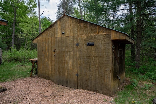 N8378 Timber Trl, New Lisbon, WI 53950 - view of outbuilding with a wooded view