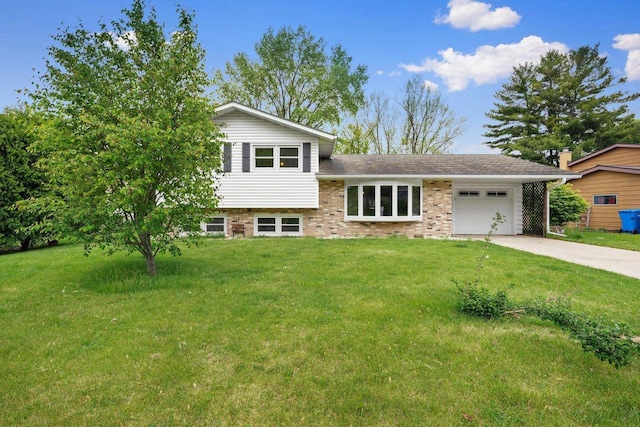 115 Edward St, Verona, WI 53593 - split level home with concrete driveway, a garage, a front yard, and brick siding