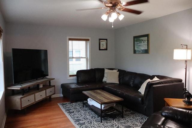 811 Spruce Dr, La Crescent, MN 55947 - living room featuring light wood-style floors, a ceiling fan, and baseboards
