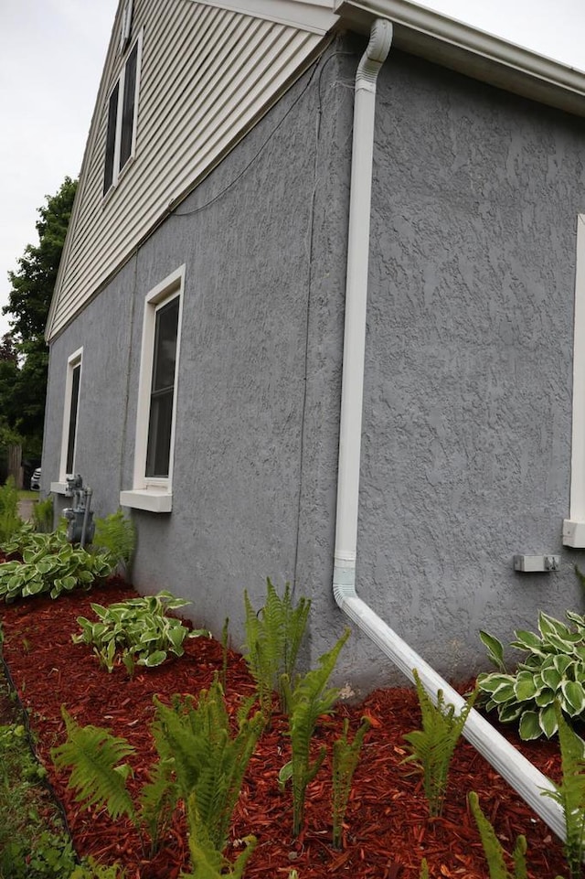 811 Spruce Dr, La Crescent, MN 55947 - view of home's exterior featuring stucco siding