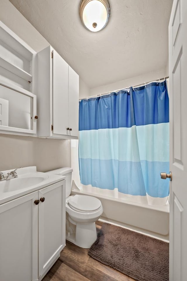 1215 Hastings St, Green Bay, WI 54301 - bathroom with wood finished floors, vanity, toilet, and shower / bath combination with curtain