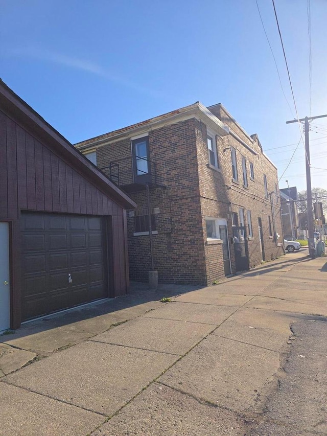 945 N Memorial Dr, Racine, WI 53404 - view of home's exterior featuring brick siding and a garage