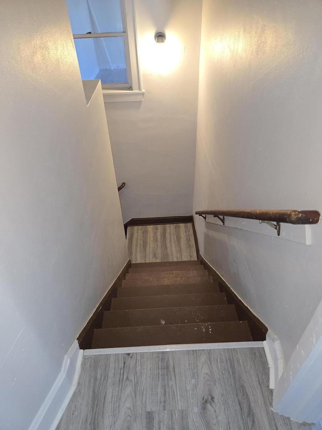945 N Memorial Dr, Racine, WI 53404 - staircase with wood finished floors and baseboards