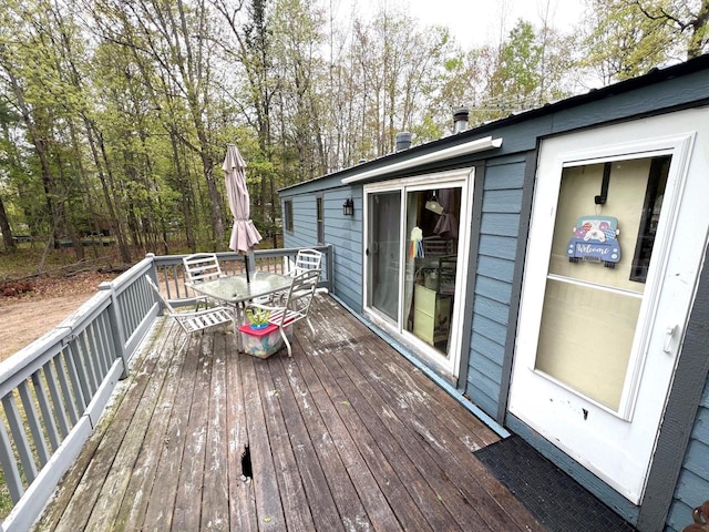 6898 Barbara Dr, Lake Tomahawk, WI 54539 - wooden deck featuring outdoor dining space