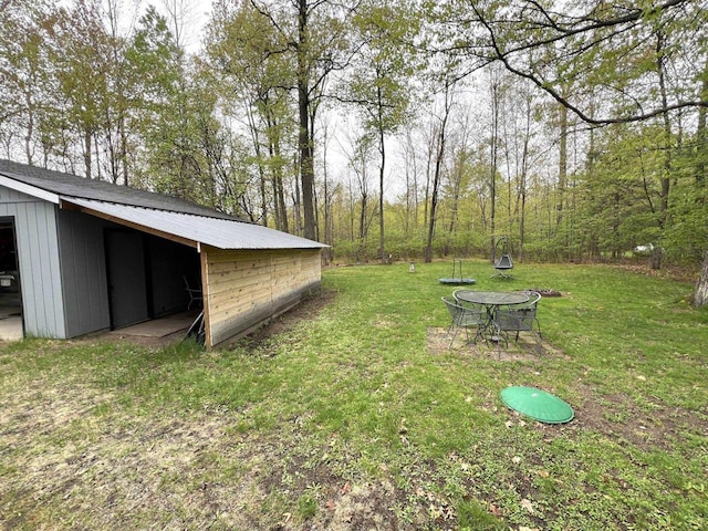 6898 Barbara Dr, Lake Tomahawk, WI 54539 - view of grassy yard with an outbuilding and an outdoor structure