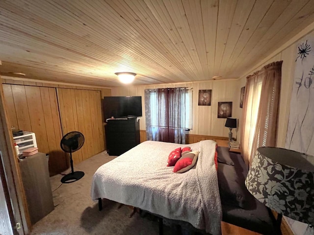 6898 Barbara Dr, Lake Tomahawk, WI 54539 - bedroom with light carpet, wood ceiling, wooden walls, and multiple windows