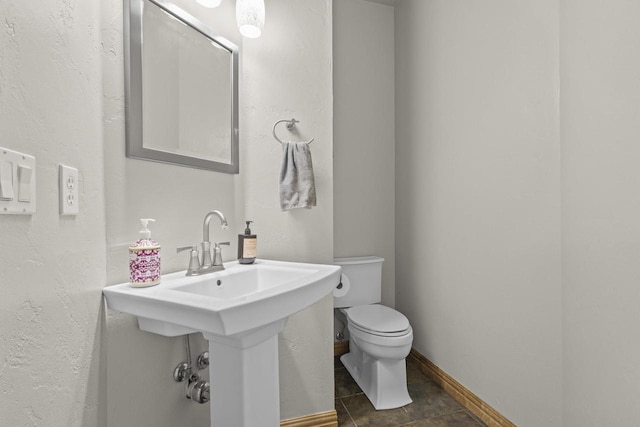 216 Deforest Dr, Kaukauna, WI 54130 - bathroom featuring toilet and baseboards