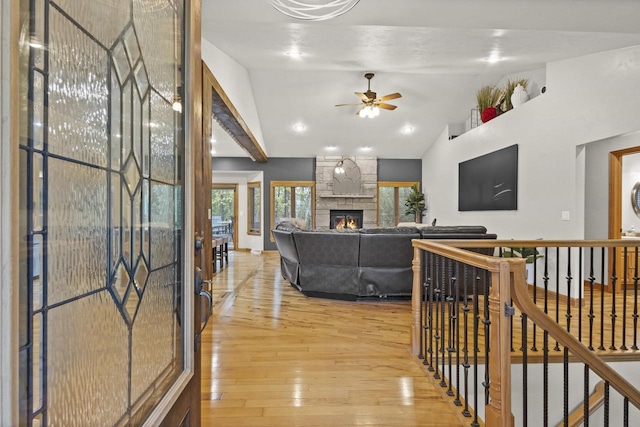 216 Deforest Dr, Kaukauna, WI 54130 - hallway with light wood finished floors, vaulted ceiling, an upstairs landing, and baseboards