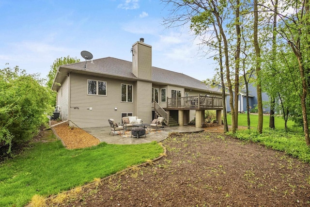216 Deforest Dr, Kaukauna, WI 54130 - rear view of house featuring a patio area, a deck, stairway, a chimney, and a lawn