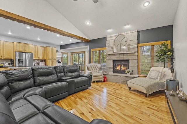 216 Deforest Dr, Kaukauna, WI 54130 - living area with wood finished floors, recessed lighting, a ceiling fan, lofted ceiling, and a stone fireplace
