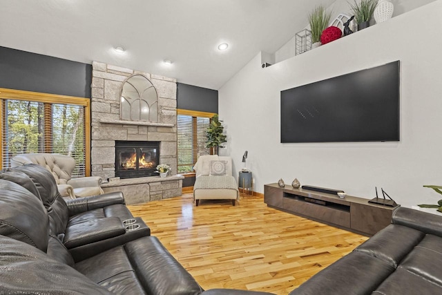 216 Deforest Dr, Kaukauna, WI 54130 - living area with wood finished floors, a fireplace, healthy amount of natural light, vaulted ceiling, and recessed lighting