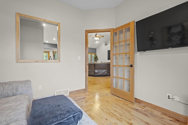 216 Deforest Dr, Kaukauna, WI 54130 - living area featuring hardwood / wood-style flooring, ceiling fan, french doors, baseboards, and lofted ceiling