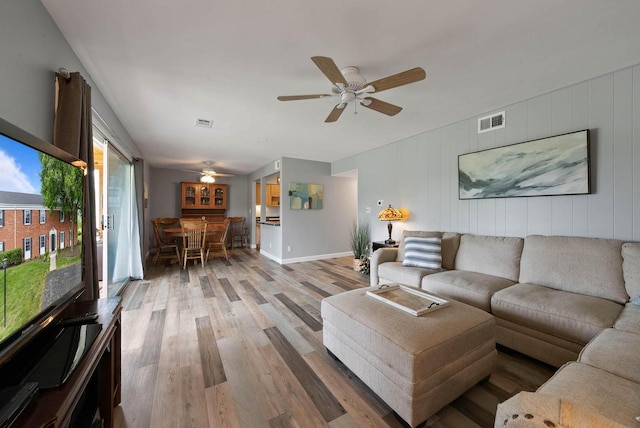 348 County Road B 8, Fontana, WI 53125 - living area featuring light wood-style flooring, a ceiling fan, and baseboards