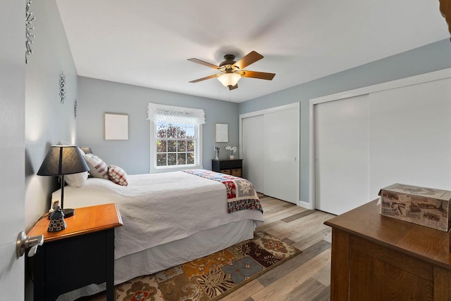 348 County Road B 8, Fontana, WI 53125 - bedroom featuring two closets, wood finished floors, and ceiling fan