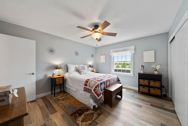 348 County Road B 8, Fontana, WI 53125 - bedroom featuring wood finished floors, a closet, baseboards, and ceiling fan
