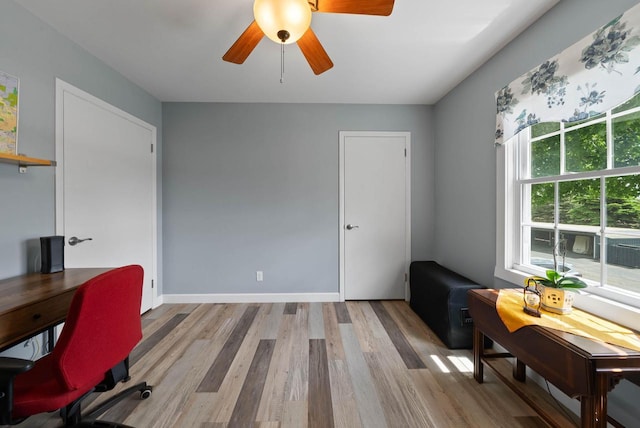 348 County Road B 8, Fontana, WI 53125 - home office featuring wood finished floors, a ceiling fan, and baseboards