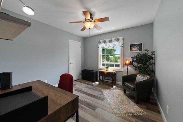 348 County Road B 8, Fontana, WI 53125 - home office featuring a ceiling fan, wood finished floors, and baseboards