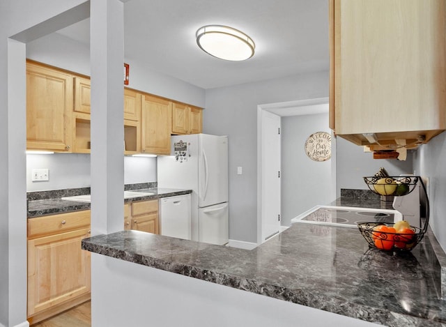 348 County Road B 8, Fontana, WI 53125 - kitchen featuring light brown cabinets, white appliances, a peninsula, a sink, and dark stone countertops