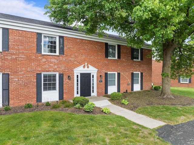 348 County Road B 8, Fontana, WI 53125 - colonial-style house with a front lawn and brick siding
