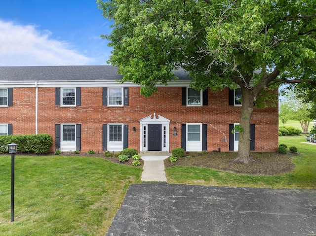 348 County Road B 8, Fontana, WI 53125 - view of front of house featuring a front lawn and brick siding