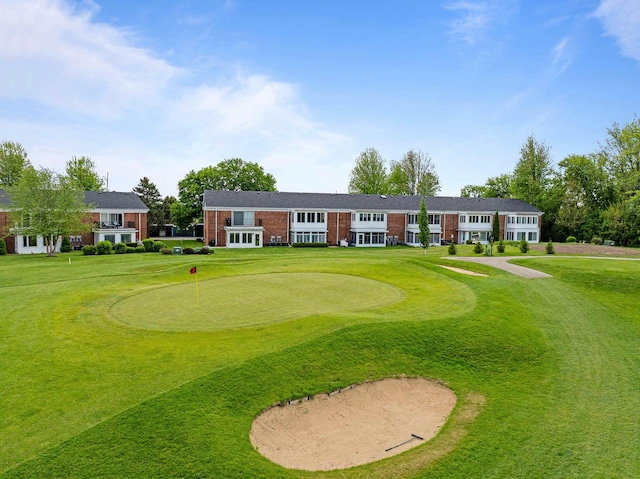 348 County Road B 8, Fontana, WI 53125 - view of home's community featuring a putting green, view of golf course, and a lawn