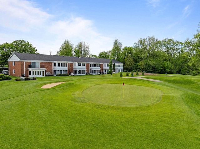 348 County Road B 8, Fontana, WI 53125 - view of community featuring golf course view, a putting area, and a lawn