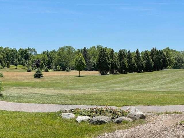 348 County Road B 8, Fontana, WI 53125 - surrounding community with a lawn and view of golf course