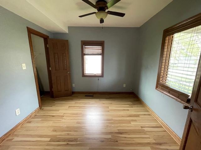 120 Hudson St, Antigo, WI 54409 - spare room with a ceiling fan, light wood-style floors, and baseboards