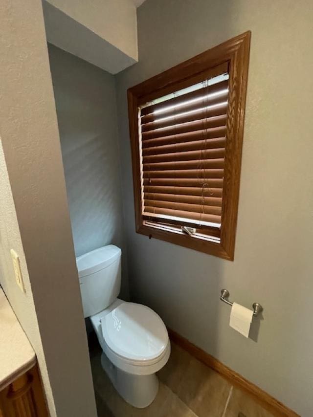 120 Hudson St, Antigo, WI 54409 - bathroom with toilet, vanity, tile patterned flooring, and baseboards