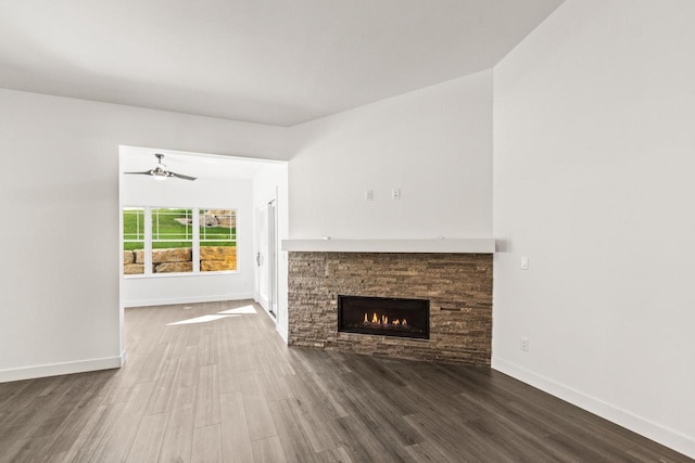 28 Sienna Hills Cir, Mount Horeb, WI 53572 - unfurnished living room with ceiling fan, wood finished floors, a fireplace, and baseboards