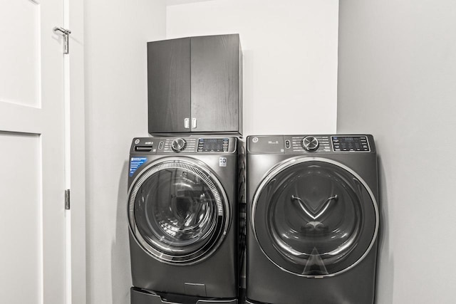 28 Sienna Hills Cir, Mount Horeb, WI 53572 - laundry area with washing machine and clothes dryer and cabinet space