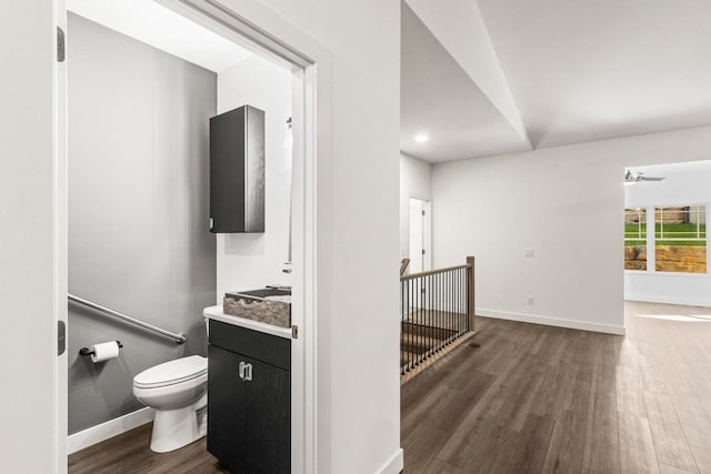 28 Sienna Hills Cir, Mount Horeb, WI 53572 - bathroom with toilet, vanity, wood finished floors, and baseboards