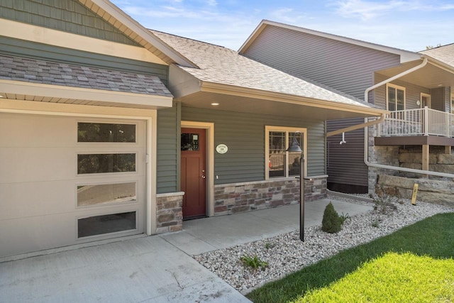 28 Sienna Hills Cir, Mount Horeb, WI 53572 - view of exterior entry featuring stone siding, a porch, and a shingled roof