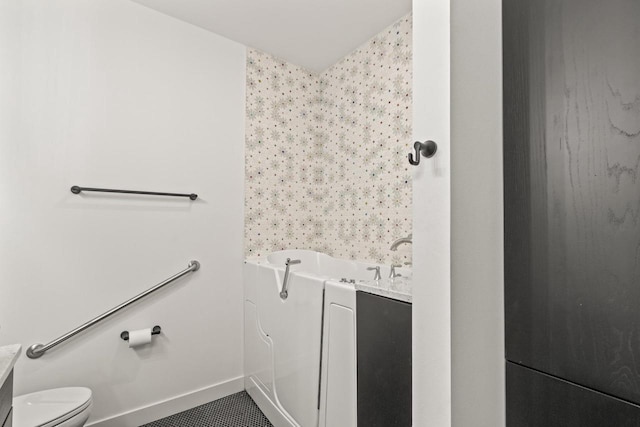 28 Sienna Hills Cir, Mount Horeb, WI 53572 - full bathroom featuring a bathtub, toilet, baseboards, and tile patterned flooring