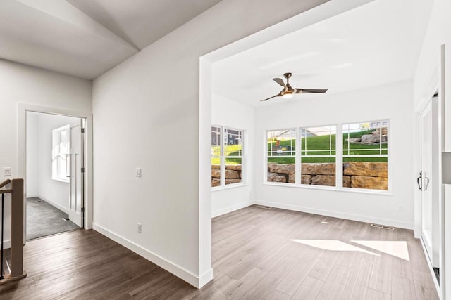 28 Sienna Hills Cir, Mount Horeb, WI 53572 - unfurnished room featuring wood finished floors, baseboards, and ceiling fan