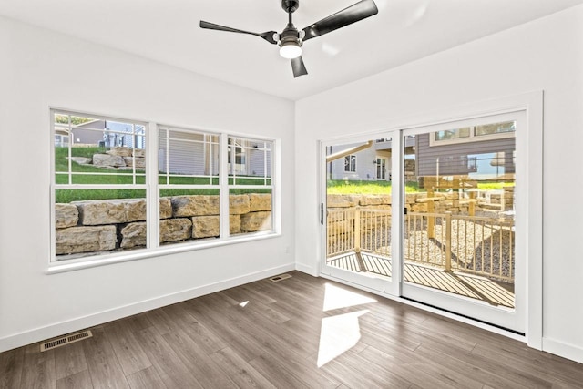 28 Sienna Hills Cir, Mount Horeb, WI 53572 - spare room featuring wood finished floors, baseboards, and ceiling fan