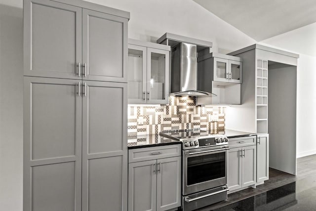 28 Sienna Hills Cir, Mount Horeb, WI 53572 - kitchen with stainless steel range with electric cooktop, wall chimney exhaust hood, backsplash, glass insert cabinets, and gray cabinetry