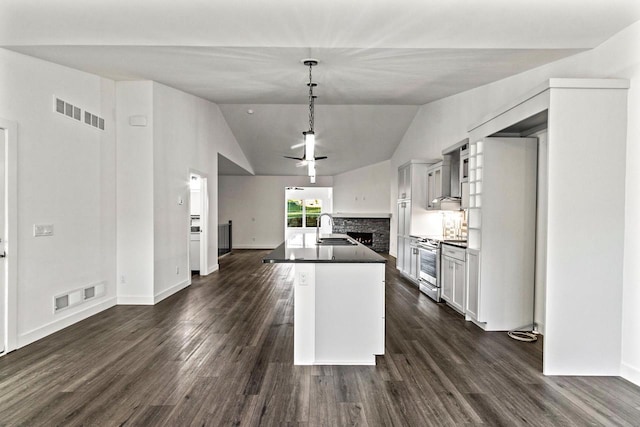 28 Sienna Hills Cir, Mount Horeb, WI 53572 - kitchen featuring a sink, stainless steel range with electric stovetop, dark countertops, ceiling fan, and a fireplace